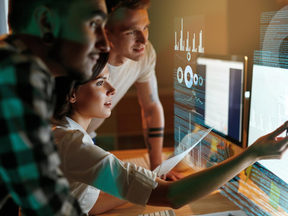 People at computer looking at apps