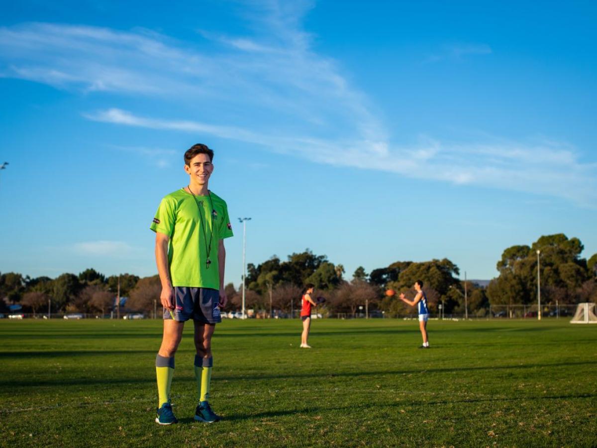 A man working as an umpire at a football game.