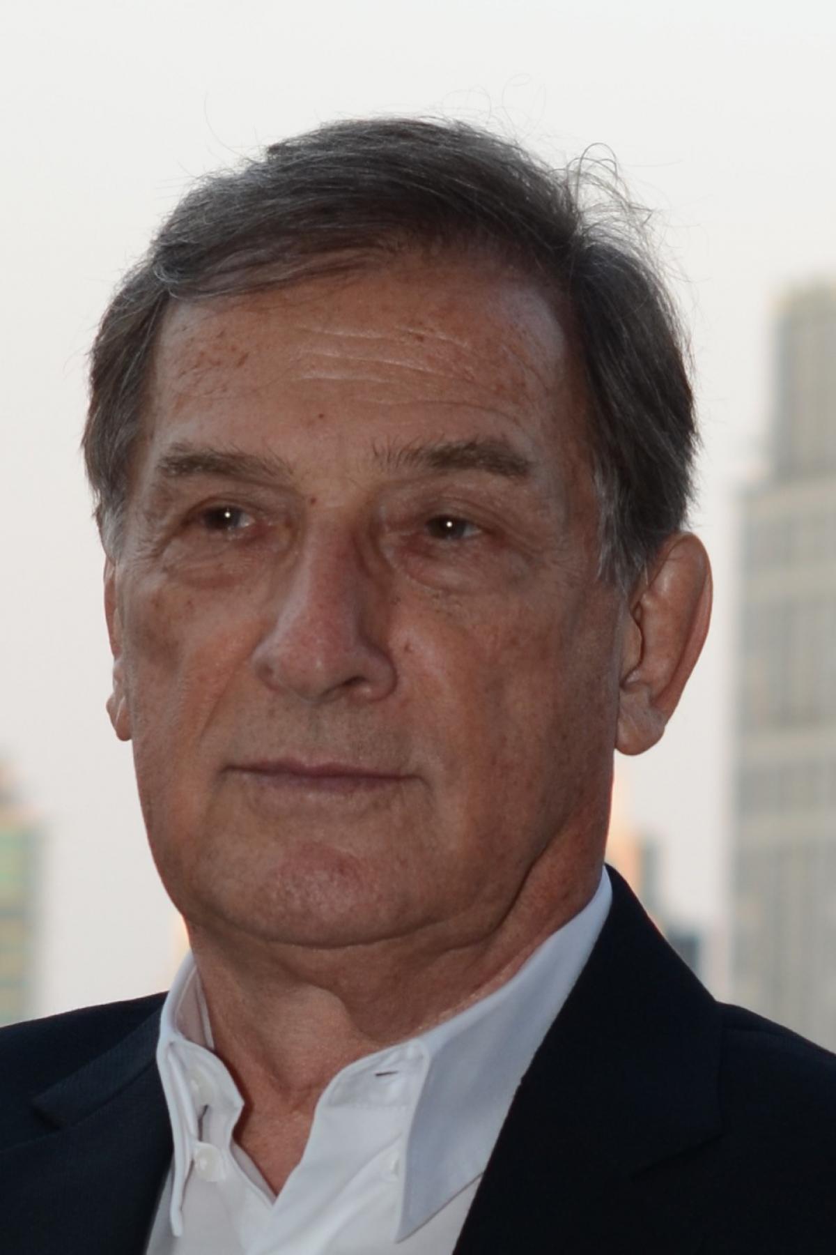 A photo of John in a suit