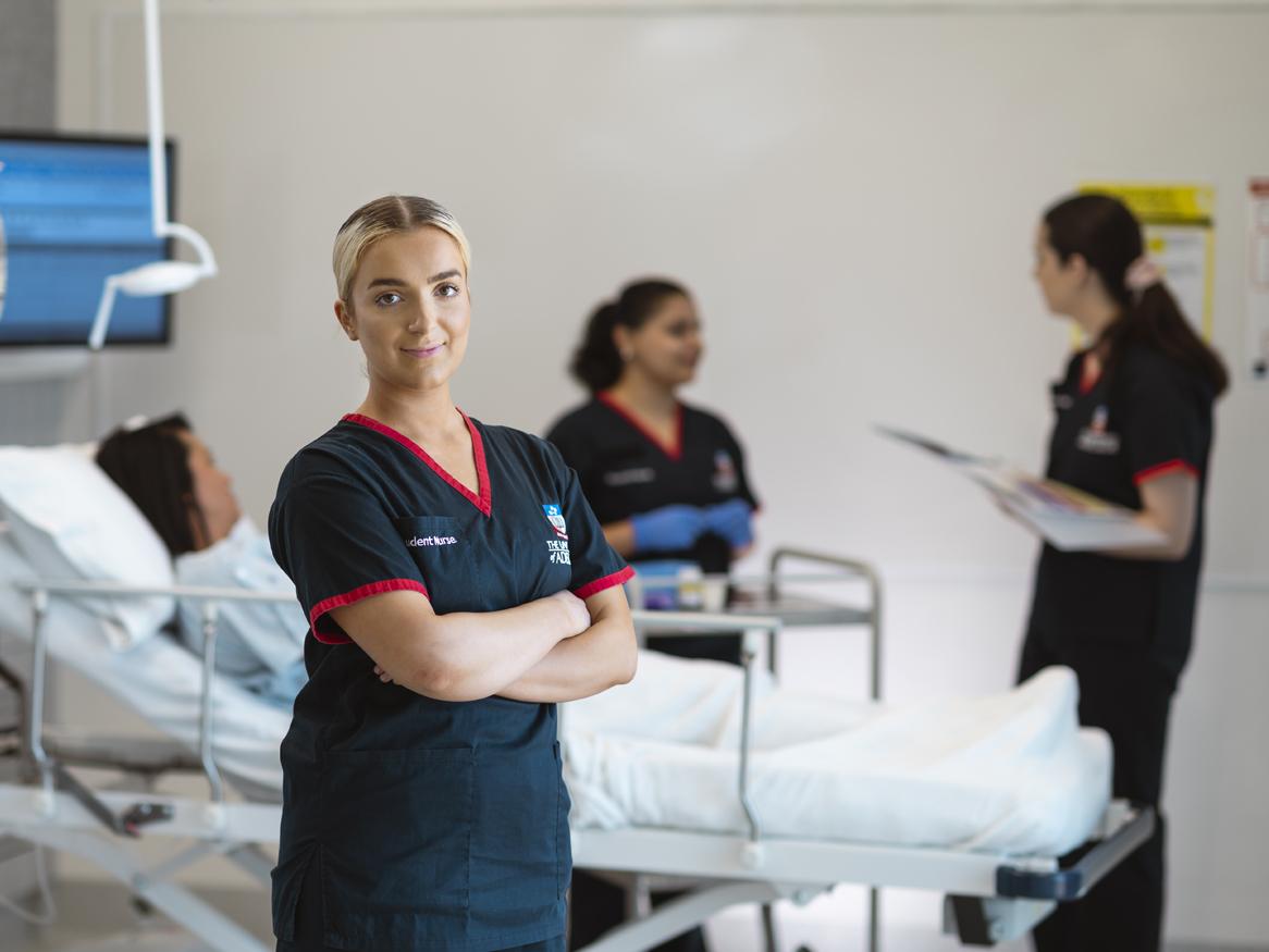 Nurse with patient in background