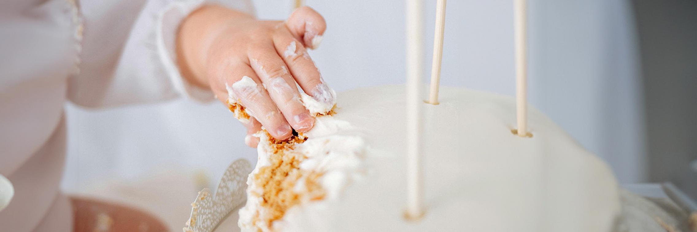 Kid eating a birthday cake
