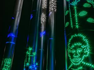 Close up of Kaurna poles lit up at night