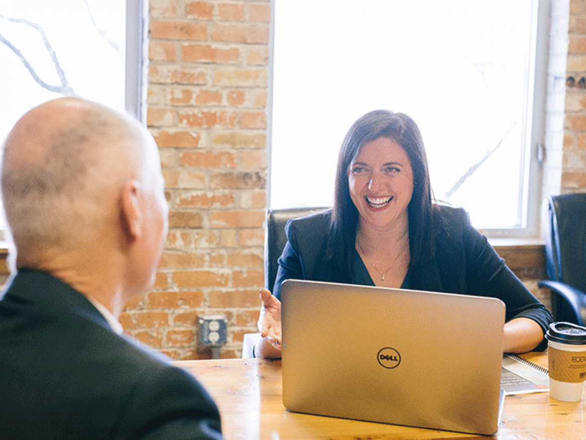 Two professionals engaging in a coaching and mentoring session